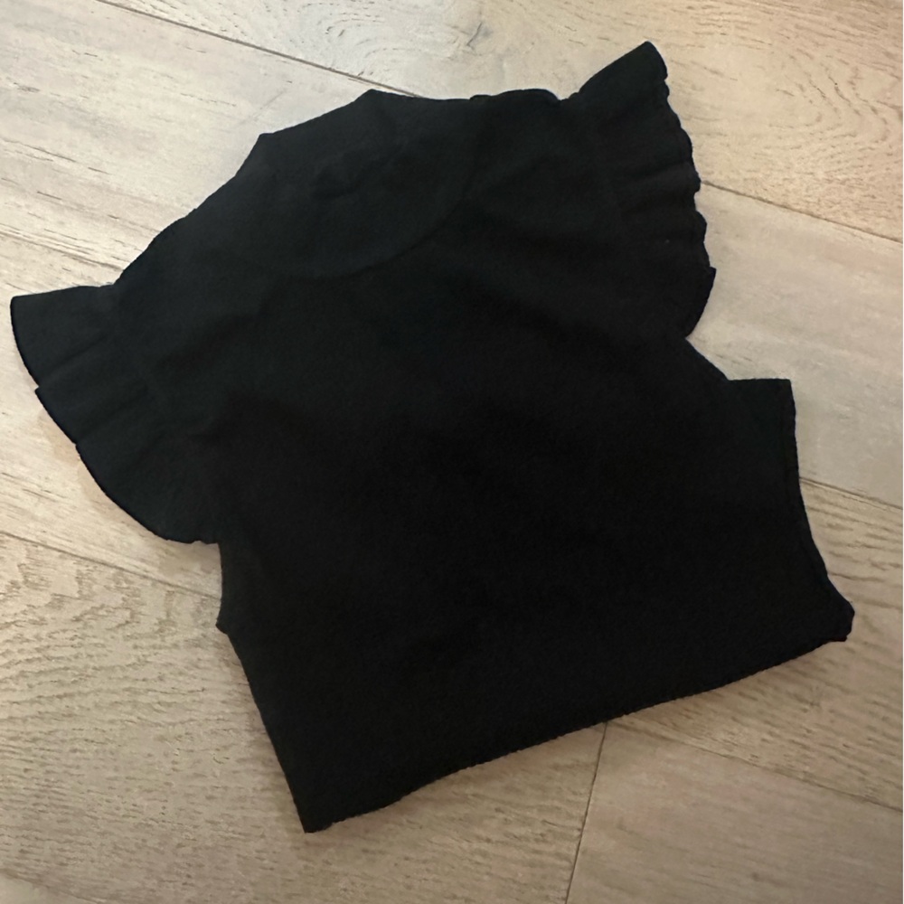 Black ruffled shirt